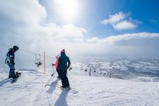 Overlooking a town from high up on a ski slopes.