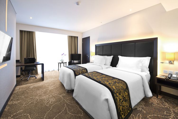 Tipe kamar twin deluxe room di Meliá Makassar, Sulawesi Selatan.