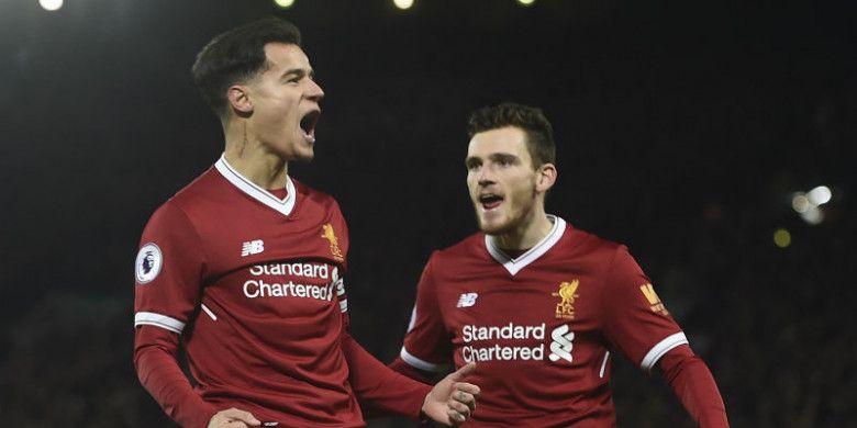 Gelandang Liverpool, Philippe Coutinho, melakukan selebrasi seusai menjebol gawang Swansea City dalam laga di Anfield, Selasa (26/12/2017)