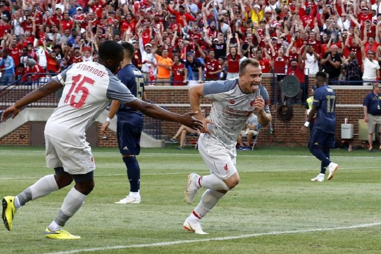 Xherdan Shaqiri merayakan  gol Liverpool pada laga ICC 2018 di Michigan, 28 Juli 2018. 
