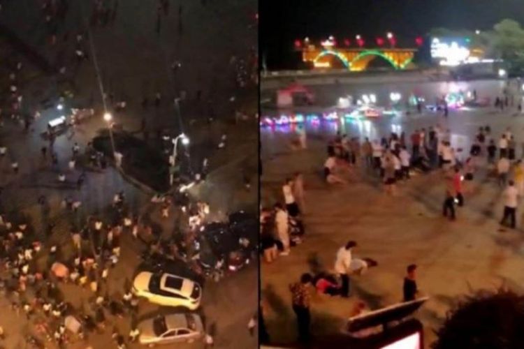 Warga panik setelah mobil menabrak kerumunan warga di alun-alun Binjiang, kota Hengyang, provinsi Hunan, China. Insiden itu menewaskan 9 orang. (Apple Daily via Straits Times)