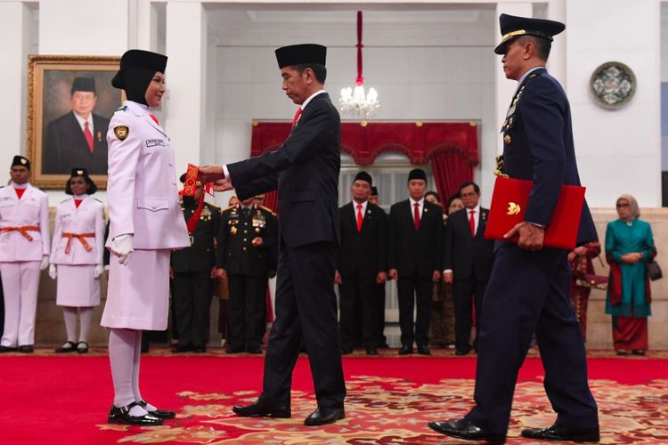 Suasana pengukugan Paskibraka oleh Presiden Joko Widodo di Istana Negara, Jakarta, Rabu (15/8/2018).