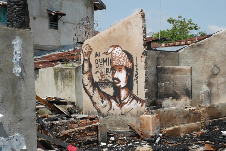 Mural di lokasi rumah yang pernah terjadi kebakaran di  Kampung Bandar, Senapelan, Pekanbaru, Riau, Jumat (9/3/2018).
