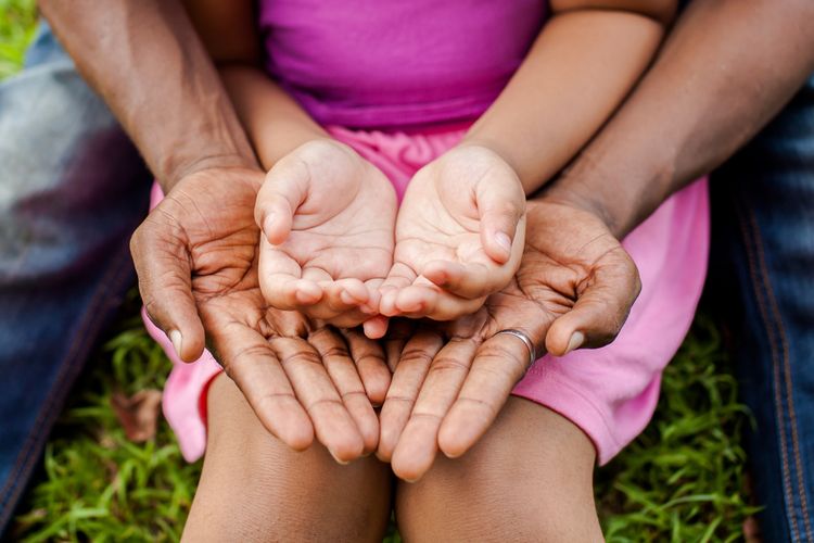 Hands symbolising care and family support