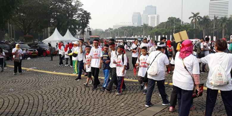 Suasana keramaian warga Ibu kota di Festival Damai yang digelar Polda Metro Jaya di Kawasan Monas, Jakarta Pusat, Minggu (23/6/2019).