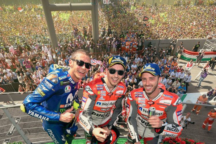 Valentino Rossi, Jorge Lorenzo, dan Andrea Dovizioso yang meraih podium di MotoGP Italia, Minggu (3/6/2018).
