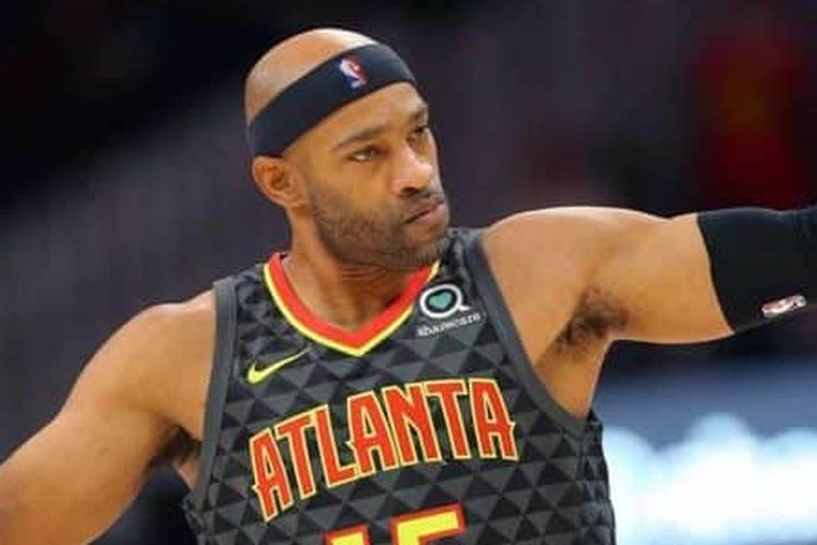 Atlanta Hawks forward Vince Carter reacts after making a three-point basket during the first half of an NBA basketball game against the Utah Jazz, Thursday, March 21, 2019, in Atlanta
