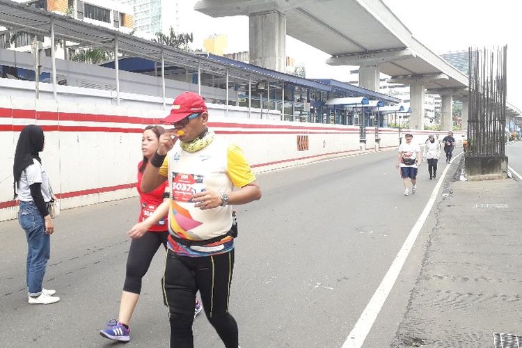 Suasana Electric Jakarta Marathon yang diikuti oleh 3 jarak tempuh yakni 5 K, 21 K dan 42 K di Jalan HR Rasuna Said, Kuningan, Jakarta Selatan pada Minggu (28/10/2018). 