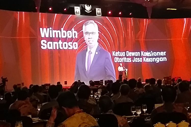 Ketua Dewan Komisioner OJK Wimboh Santoso saat memberi paparan kinerja OJK selama 2018 dalam Pertemuan Tahunan Industri Jasa Keuangan di Jakarta, Jumat (11/1/2019).