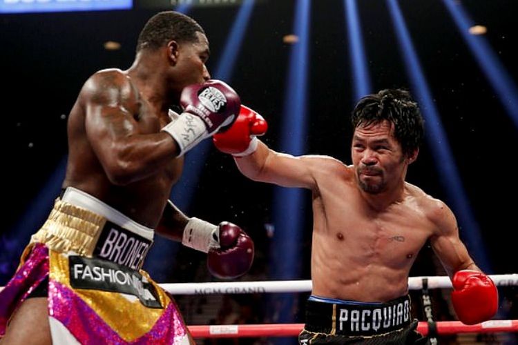 Manny Pacquiao (kanan) saat menghadapi Adrien Broner, Sabtu (19/01/2019)