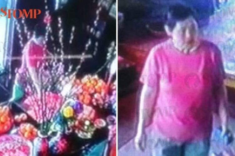 Rekaman CCTV memperlihatkan seorang perempuan berada di kuil di Singapura, dan mengambil angpau yang disediakan di sana.
