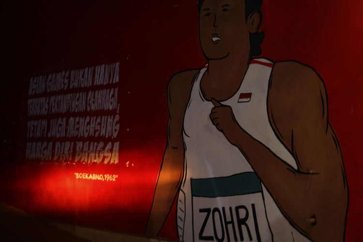 Mural bergambar pelari Indonesia, Lalu Muhammad Zohri di Kampung Asian Games Pucang Sawit, Solo, Jawa Tengah, Sabtu (25/8/2018). Meskipun tidak bisa mendukung atlet Indonesia secara langsung saat gelaran Asian Games 2018 berlangsung di Jakarta dan Palembang, seniman mural dari Komunitas Mewarnai Indonesia Mural Company di Solo menggambar ekspresi atlet-atlet Indonesia peraih medali emas.