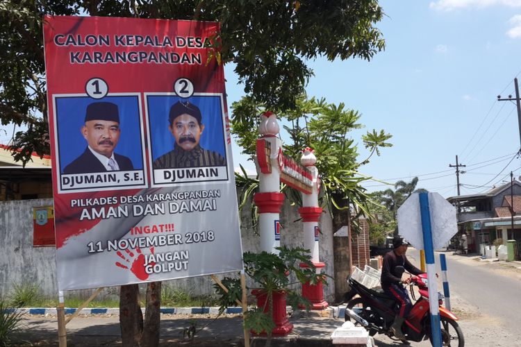 Alat peraga kampanye Pilkades Karangpandang, Kecamatan Pakisaji, Kabupaten Malang yang diikuti oleh dua kandidat bernama Djumain, Selasa (30/10/2018)