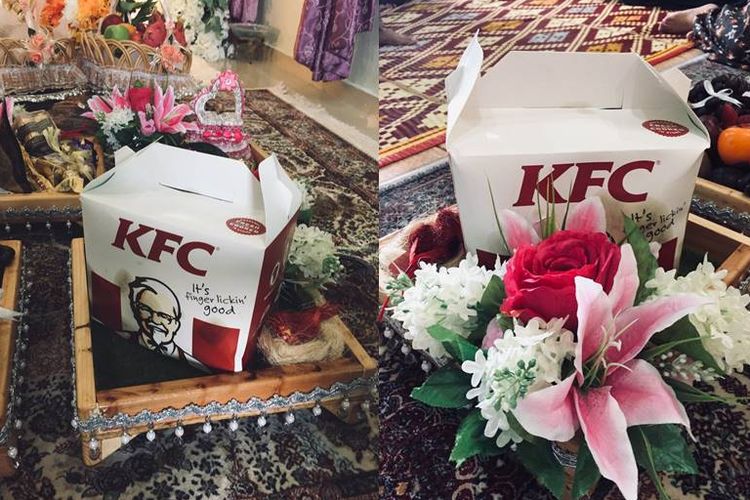 Mas Idayu Nanyan (24) dan Abdul Fakih (27), dua warga Malaysia yang melangsungkan pertunangan dengan menyuguhkan ayam goreng KFC.