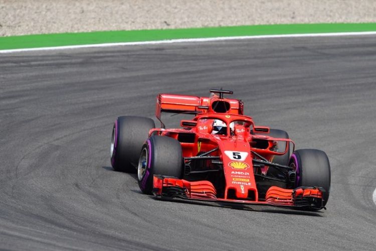 Pebalap Ferrari, Sebastian Vettel, saat menjalani balapan GP Jerman di Hockenheimring, Minggu (22/7/2018).
