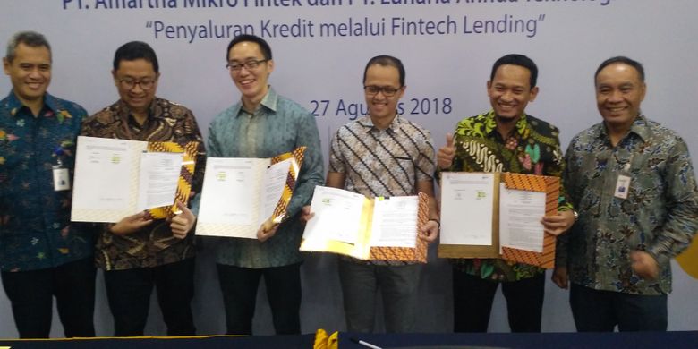 Bank Mandiri menandatangani perjanjian kerja sama dengan dua perusahaan fintech, Amartha dan KoinWork, di Plaza Mandiri, Jakarta, Senin (27/8/2018).