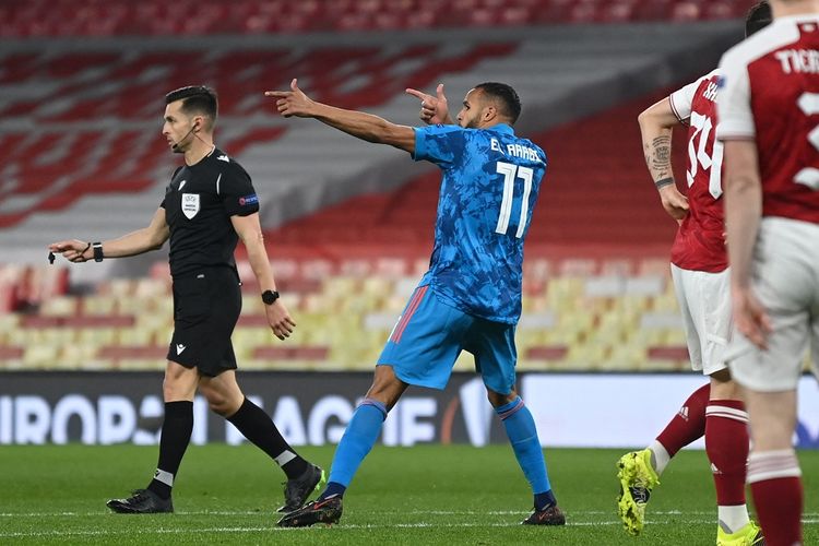 Penyerang Olympiakos, Youssed El-Arabi, merayakan gol ke gawang Arsenal pada leg kedua 16 besar Liga Europa yang berlangsung di Stadion Emirates, London, Jumat (19/3/2021) dini hari WIB.