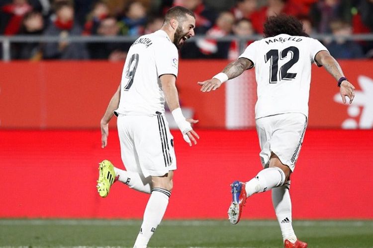 Karim Benzema dan Marcelo merayakan gol pada laga leg kedua babak perempat final Copa del Rey antara Girona vs Real Madrid.