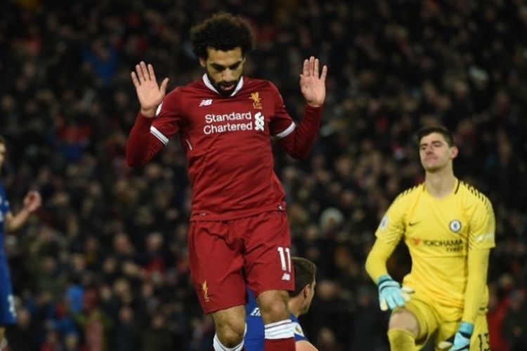 Aksi pemain Liverpool, Mohamed Salah, setelah mencetak gol ke gawang Chelsea dalam laga lanjutan Liga Inggris di Stadion Anfield, Minggu (26/11/2017) dini hari WIB.