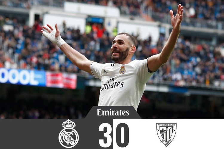 Striker Real Madrid, Karim Benzema, melakukan selebrasi setelah mencetak gol ke gawang Athletico Bilbao. Benzema mencetak hat-trick alias trigol untuk membawa Madrid menang 3-0.