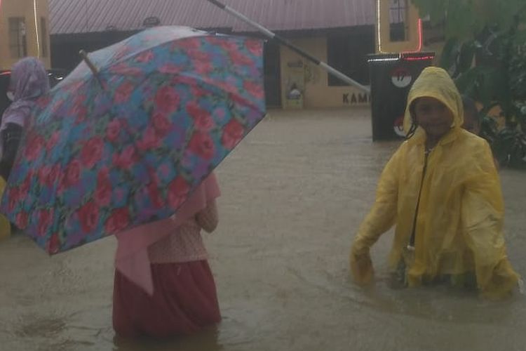 Residents in flood affected areas in Matangkuli sub-district in North Aceh on Sunday, December 6, 2020.  