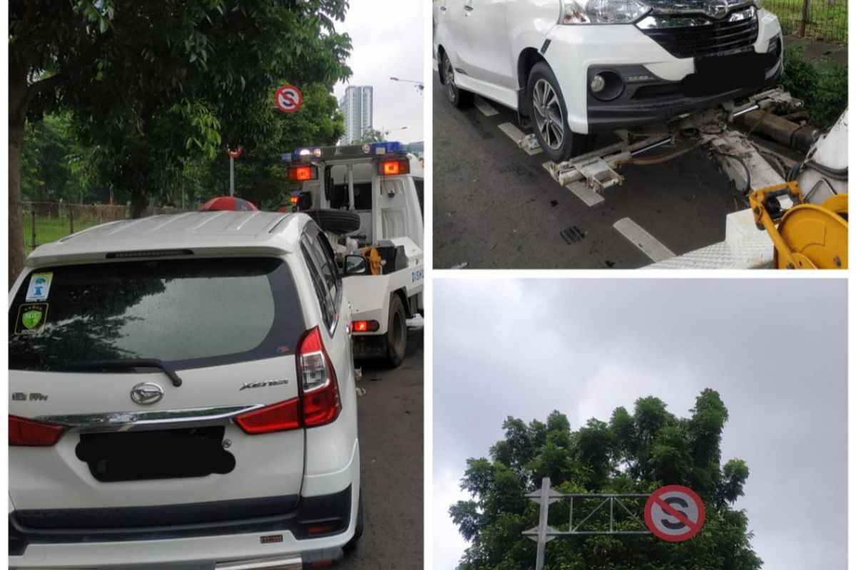 Mobil yang diderek pihak Sudinhub Jakbar karena parkir di jalur sepeda sekitar kawasan Kembangan, Jakarta Barat