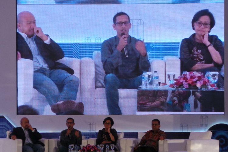 Seminar Hari Oeang yang dihadiri oleh Menteri Keuangan Sri Mulyani, CEO Go-Jek Indonesia Nadiem Makarim, Ketua Bidang Ekonomi dan Bisnis idEA Ignatius Untung, dan Menkominfo Rudiantara, di Gedung Dhanapala Kementerian Keuangan, Jakarta Pusat, Kamis (26/10/2017). 