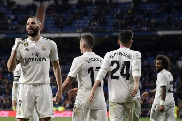 Karim Benzema merayakan golnya pada pertandingan Real Madrid vs Huesca dalam lanjutan La Liga Spanyol di Stadion Santiago Bernabeu, 31 Maret 2019. 