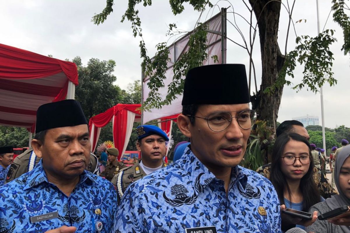 Wakil Gubernur DKI Jakarta Sandiaga Uno usai memimpin apel Hari Otonomi Daerah di Lapangan Eks IRTI Monas, Rabu (25/4/2018). 