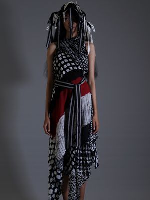 A model wearing lurik, Indonesian traditional weaving fabric, by fashion designer Lulu Lutfi Labibi.                               