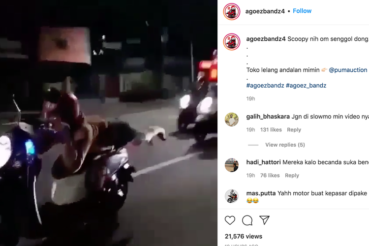 Pengendara motor berlagak ala Superman di jalan raya