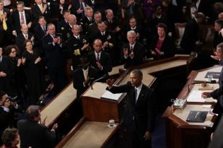 Presiden AS Barack Obama melambaikan tangan ke arah hadirin usai menyampaikan pidato kenegaraan tahunan di depan kongres, Selasa (20/1/2015)