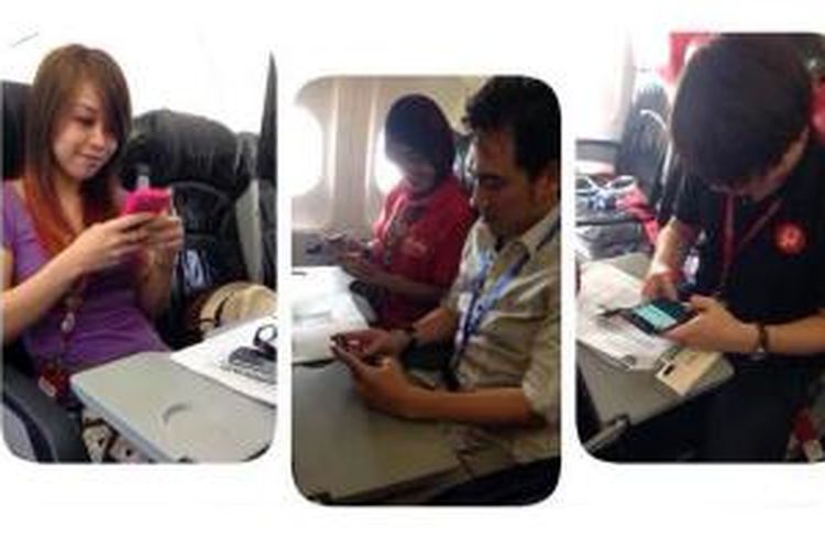Uji coba layanan Wi-Fi onboard di armada Malaysia AirAsia, Rabu (13/8/2014). Layanan ini akan tersedia di seluruh penerbangan Malaysia AirAsia (AK) di akhir tahun, termasuk penerbangan ke kota-kota di Indonesia.