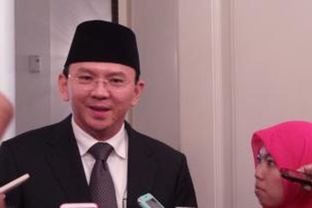 Gubernur DKI Jakarta Basuki Tjahaja Purnama seusai menghadiri rapat paripurna Laporan Hasil Pemeriksaan (LHP) BPK RI terhadap laporan keuangan anggaran 2014, di Balairung, Balai Kota, Senin (6/7/2015). 