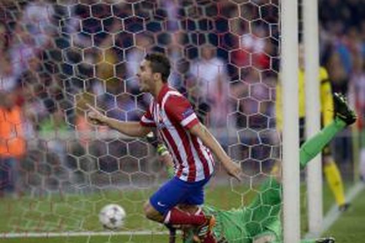 Gelandang Atletico Madrid, Koke, merayakan golnya ke gawang Barcelona pada leg kedua perempat final Liga Champions, di Vicente Calderon, Rabu (9/4/2014).