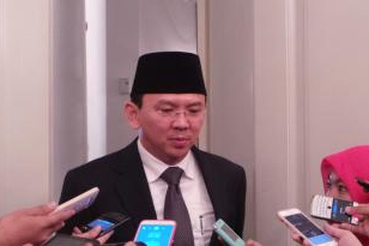 Gubernur DKI Jakarta Basuki Tjahaja Purnama seusai menghadiri rapat paripurna Laporan Hasil Pemeriksaan (LHP) BPK RI terhadap laporan keuangan anggaran 2014, di Balairung, Balai Kota, Senin (6/7/2015). 