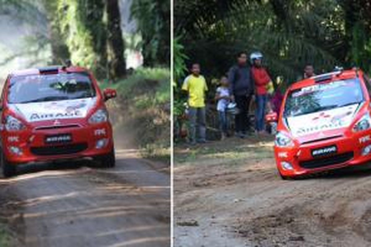 Aksi Subhan Aksa mengendarai Mitsubishi Mirage di Kejurnas Sprint Rally 2014 Seri ke-4 di Sumatera Utara.