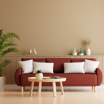 Ilustrasi ruang tamu bernuansa warna beige dengan sofa warna merah tua.