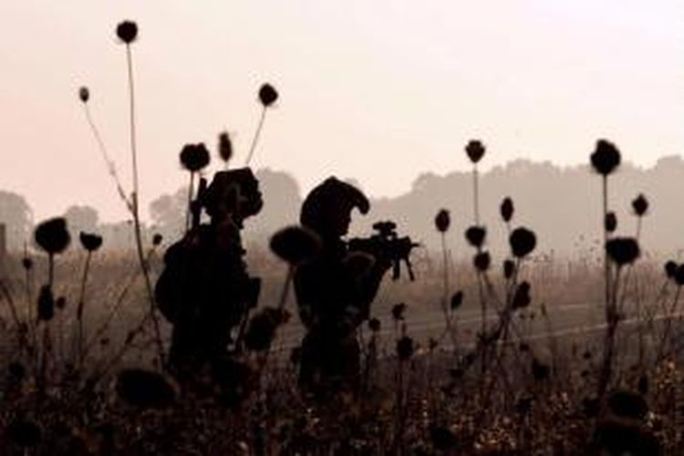 Tentara Israel dari Brigade Golani menghadiri latihan militer di Dataran Tinggi Golan dekat perbatasan dengan Suriah, 26 Juni 2013. Dataran Tinggi Golan direbut oleh Israel dari Suriah dalam Perang Enam Hari 1967.