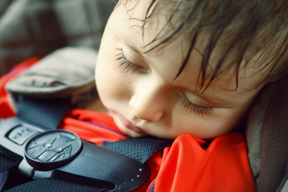 Closeup portrait of a cute adorable little boy toddler tired and sleeping belted in car seat on his trip, safety protection concept; Shutterstock ID 283664960; PO: today-david-150710