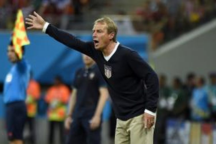 Salah satu ekspresi pelatih tim nasional Jerman, Juergen Klinsmann, pada pertandingan kedua Grup G Piala Dunia melawan Portugal, di Arena Amazonia, Manaus, 22 Juni 2014.