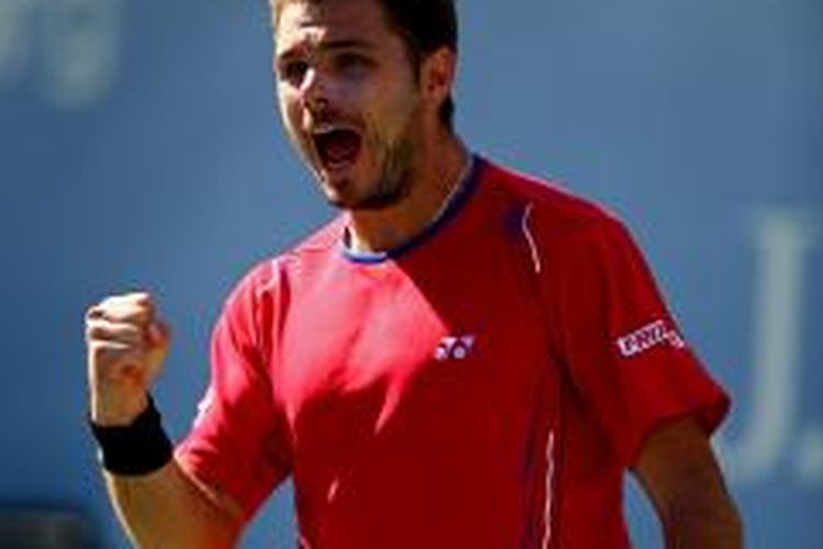 Petenis Swiss, Stanislas Wawrinka merayakan kemenangannya atas Andy Murray, pada perempat final US Open yang berlangsung di USTA Billie Jean King National Tennis Center, New York, Kamis (5/9/2013).