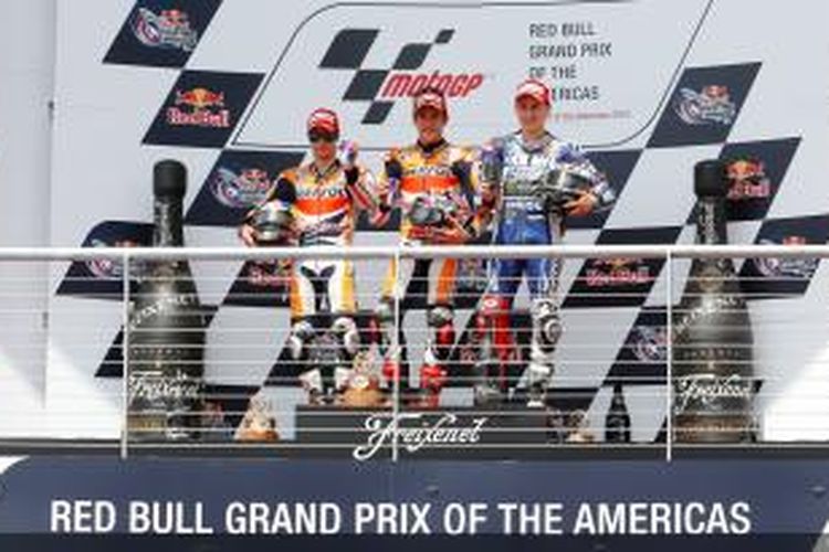 Marc Marquez (tengah), Dani Pedrosa (kiri), dan Jorge Lorenzo menguasai podium GP Americas di Austin, Texas, 21 April 2013.