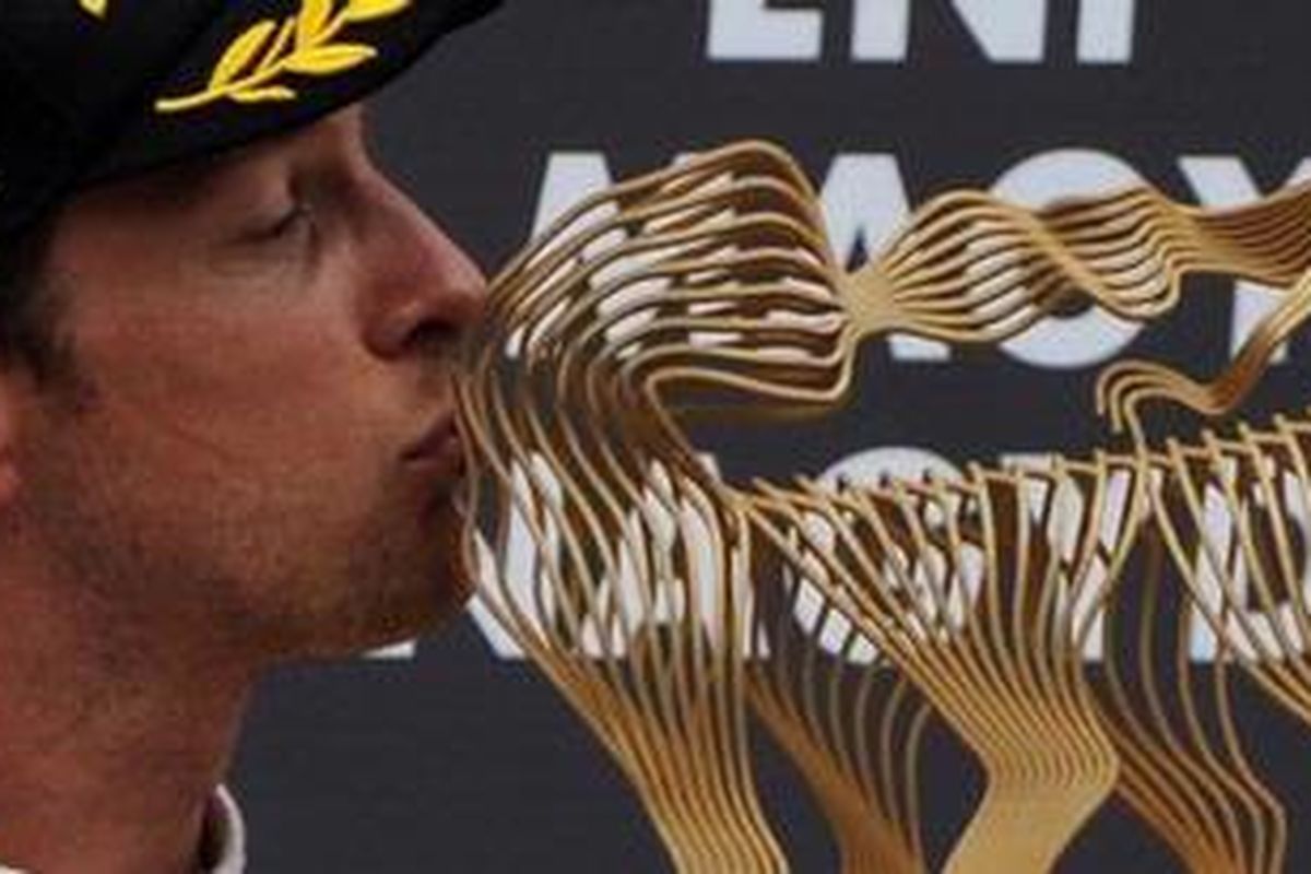 Pebalap McLaren, Jenson Button, usai menjuarai GP Hungaria, Minggu (31/7/11).