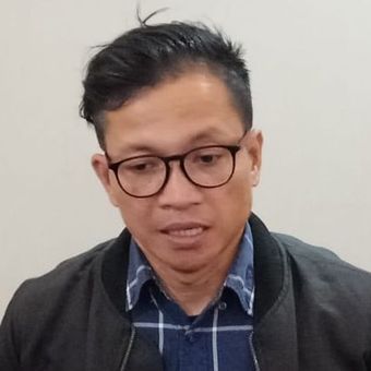 Direktur Eksekutif Amnesty International Indonesia Usman Hamid di Gedung Bareskrim Mabes Polri, Jakarta Selatan, Senin (8/7/2019).