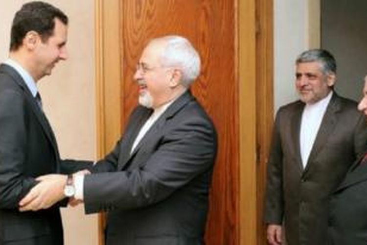Presiden Bassar al-Assad saat bertemu perwakilan pemerintah Iran.