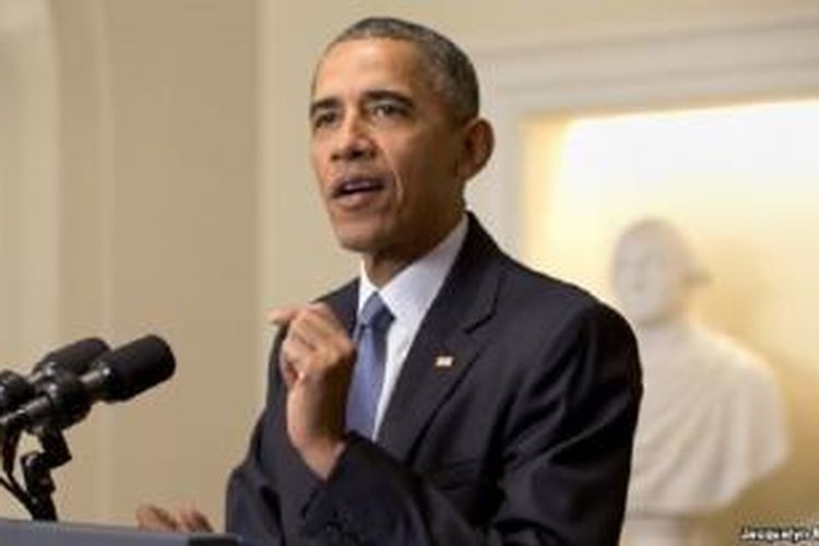 Presiden AS Barack Obama berbicara mengenai kesepakatan perjanjian iklim di Paris dalam pidato hari Sabtu (12/12/2015).