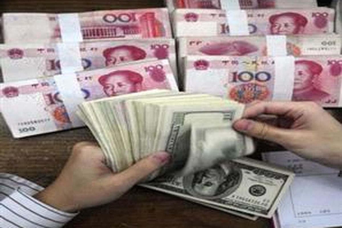 In this Oct. 16, 2009 file photo, a bank clerk counts U.S. 100 dollar bills near bundles of Chinese renminbi notes at a bank in Hefei, in central Chinas Anhui province. A decline in Chinas declared holdings of U.S. Treasury bills comes as it is trying to diversify its foreign assets. But analysts say Washingtons debt is still the only asset big enough to absorb the trade-fueled flood of cash Beijing needs to invest, and it might be adding to its hoard with secret purchases through banks abroad. 