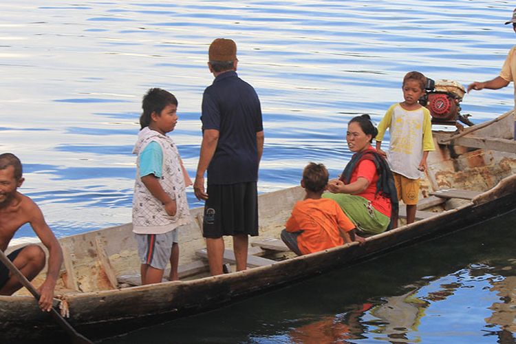 The Bajau people are on their traditional boat. They live around islands off the coastal of Sulawesi in Indonesia. 