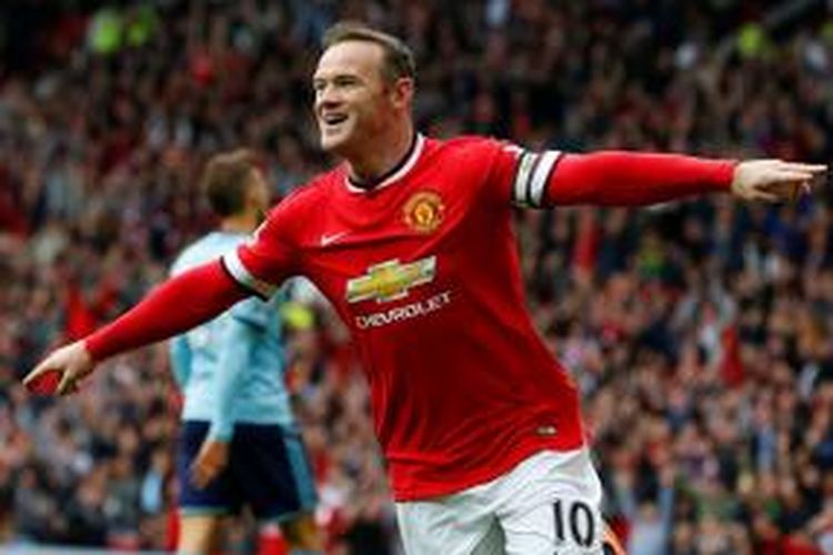 Selebrasil gol penyerang Manchester United, Wayne Rooney, seusai mencetak gol ke gawang West Ham United pada lanjutan Premier League, Sabtu (27/9/2014). 